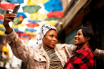 Obraz premium Portrait of a happy smiling female friends. Women taking selfie photo