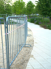 The playground is fenced with metal barriers due to restrictive measures in connection with the Covid pandemic