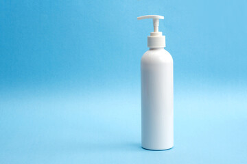 A bottle of sanitizing gel or liquid for washing hands. Cleanliness and body care concept.
