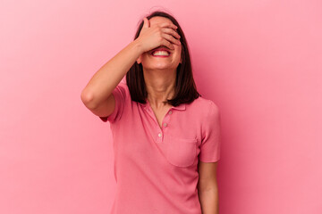 Young caucasian woman isolated on pink background covers eyes with hands, smiles broadly waiting for a surprise.