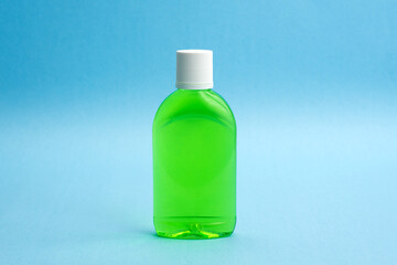 A bottle of sanitizing gel or liquid for washing hands. Cleanliness and body care concept.