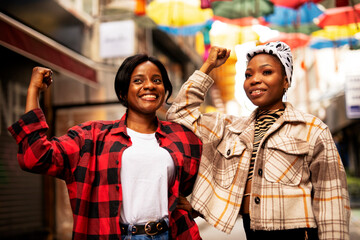 Portrait of a happy smiling female friends. Women laughing and having fun outdoors.