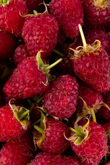 Isolated berries. Bunch of raspberry fruits with leaves isolated on white background, with clipping path