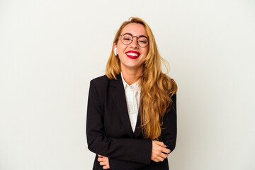 Obraz premium Caucasian business woman wearing a wireless headphones isolated on white background laughing and having fun.