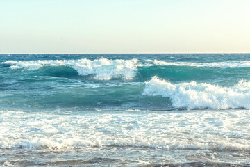 Naklejka na ściany i meble The coast of the Mediterranean Sea. The waves. The horizon. Sky and sea in summer