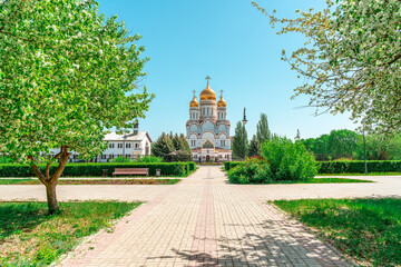 Orthodox Church with golden domes on a summer day in the blue sky, Togliatti, Russia