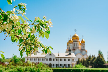 Orthodox Church with golden domes on a summer day in the blue sky, Togliatti, Russia