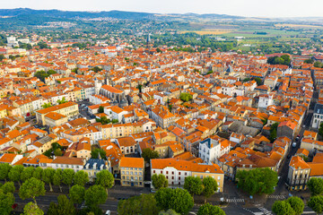 Scenic drone view of Riom summer cityscape and surroundings, Puy-de-Dome department, France
