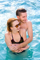 Young couple in the pool