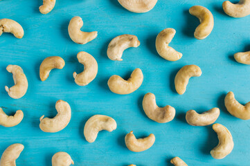 cashew nuts isolated on blue background