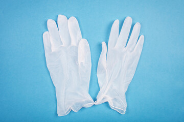 Fototapeta premium Medical gloves on a blue background. Healthcare medical. top view.