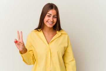 Young caucasian woman isolated on white background showing number ten with hands.