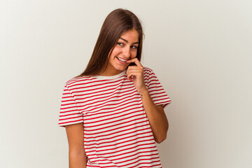 Young caucasian woman isolated on white background shocked and amazed holding a copy space between hands.