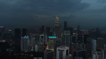 Fototapeta premium AERIAL. Cinematic view. Hight view to Kuala Lumpur city, Malaysia. Cityscape business skyscrapers night downtown.
