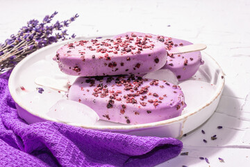 Purple Lavender flavored ice cream with flower bouquet, vintage silver spoon, ceramic stand