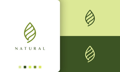 abstract green leaf logo with simple and modern style