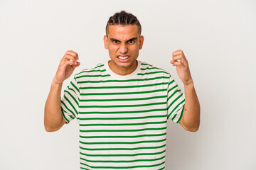 Fototapeta premium Young venezuelan man isolated on white background upset screaming with tense hands.