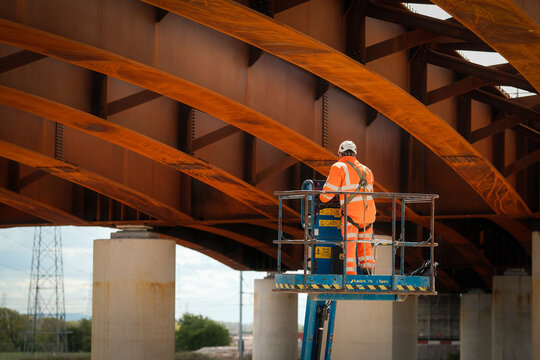 Construction Workers working at height on a new bridge which is part of the Western Distributor Road in Preston, UK.