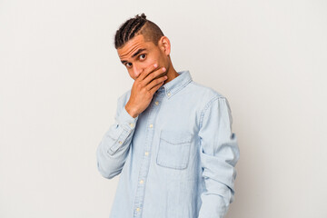 Young venezuelan man isolated on white background scared and afraid.