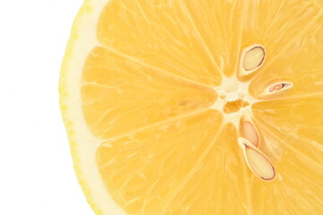 One half of a yellow juicy lemon, close-up, isolated on white.