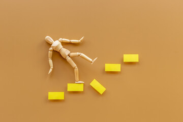Man mannequin figure falling down from stairs. Accident failure and fiasco in business concept