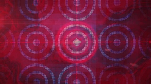Animation of red laser beams of light crossing at the centre of circualr red and blue pattern