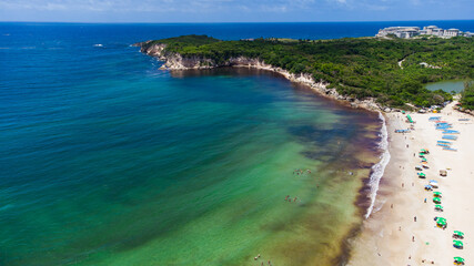 beautiful beach where you can see something similar to a peninsula and the beautiful green water beaches