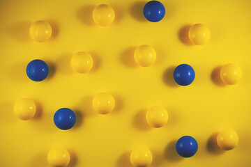 Geometric and abstract background. Round shapes on a yellow background. Stand out from the crowd, think differently. The concept of uniqueness