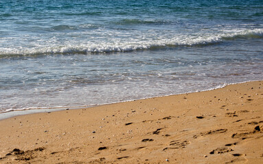 Beautiful seascape. Golden sand beach. Summer Idyllic  scenery. Calm blue water. Vacation time. 