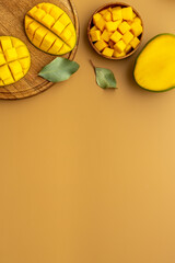 Mango fruit and mango cubes in bowl. Fruits background