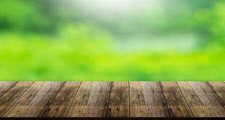 wooden table surface natural green background