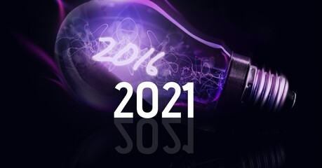 Composition of 2021 over purple lit lightbulb