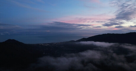 Flying over the evening time clouds with the late sun. Flight through moving cloudscape with beautiful sun rays. Traveling by air. Perfect for cinema, background