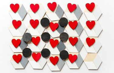 small red hearts and black discs on trompe l'oeil cubes on white