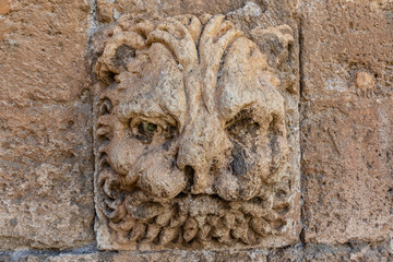 Old sculpture of a lion head in the facade of the cathedral in Almeria, Andalusia, Spain, Europe