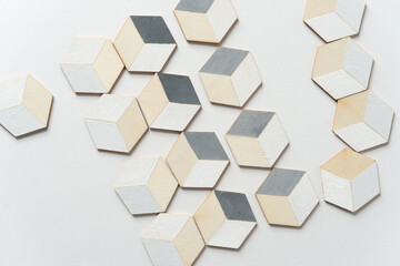 trompe l'oeil cubes loosely arranged on a white background