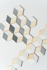 trompe l'oeil cubes loosely arranged on a white background