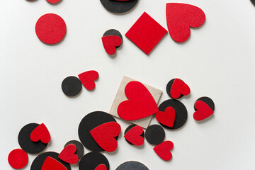 hand painted retro styled wooden hearts and shapes - photographed top-down on a light paper...