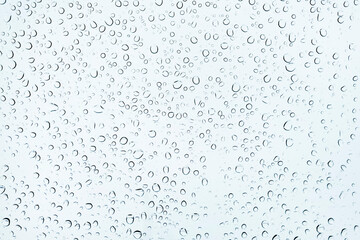 Close up Water Drops on window Glass on a autumn rainy day. rain Wet weather  Background
