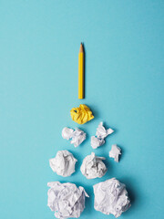 Launching pencil rocket with jet stream of paper balls, creativity concept or new ideas metaphor
