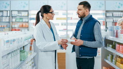 Pharmacy: Professional Female Pharmacist Helping Handsome Male Customer with Medicine...