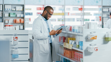Pharmacy: Portrait of Professional Black Pharmacist Uses Digital Tablet Computer, Checks Inventory...