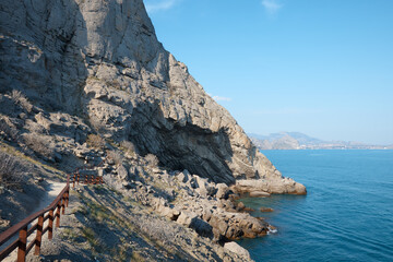 Fototapeta na wymiar seascape, sea and rocks, summer vacation at the resort, bay and embankment