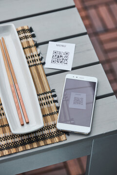 Smartphone and QR code of menu in restaurant