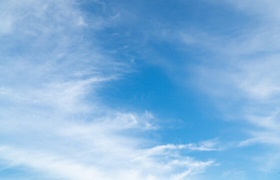 Summer Blue Sky and white cloud white background. Beautiful clear cloudy in sunlight spring season. vivid cyan cloudscape in nature environment. Outdoor horizon skyline with spring sunshine.