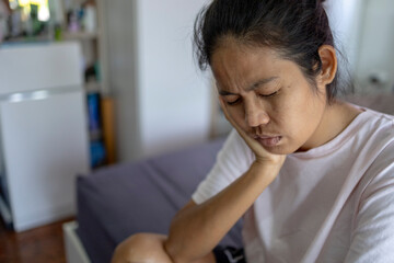 thoughtful young asian woman thinking of difficult personal problems solutions, feeling melancholic...