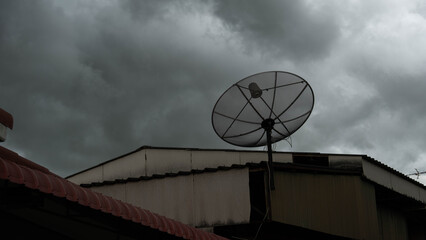 On the roof of the satellite dish, a black cloud was about to rain.