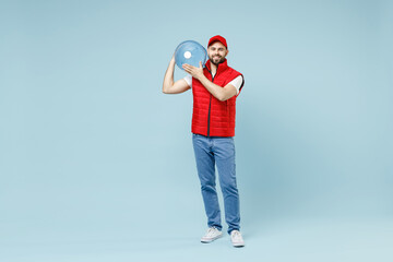 Full size body length delivery guy employee man in red cap white T-shirt vest uniform workwear work...