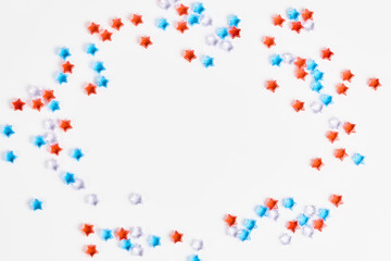 beautiful frame of blue, red and transparent stars on a white background. banner for the celebration of Independence Day on July 4th. space for text, flat lay