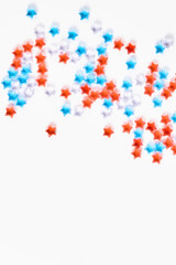 4th of July American Independence Day decorations on white background. flat lay minimalistic compositions, space for text, vertical frame